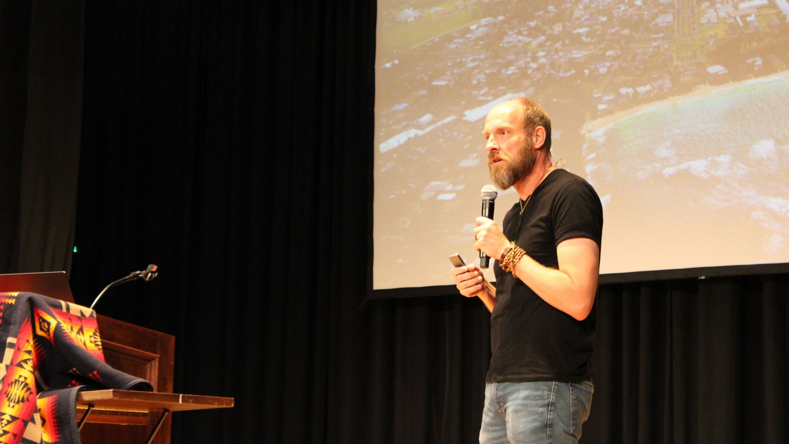 Chad Ford speaking on a stage.