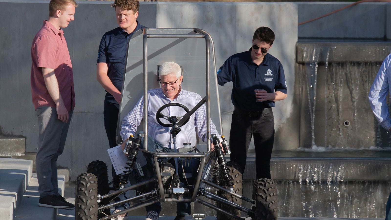 A man using a dune buggy.