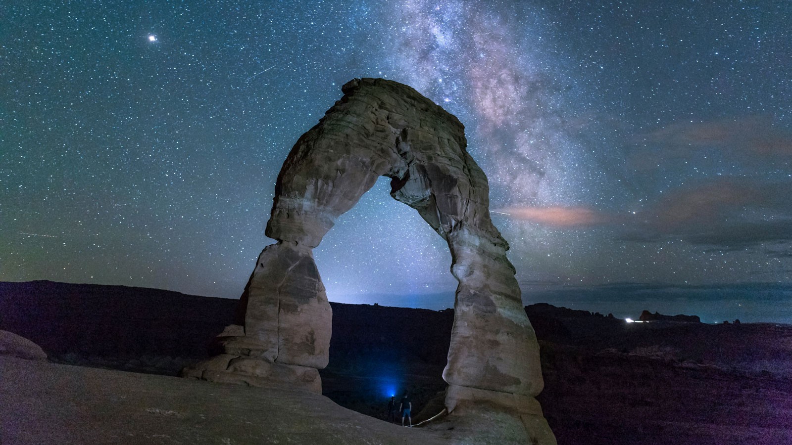 Delicate Arch against a backdrop of stars.
