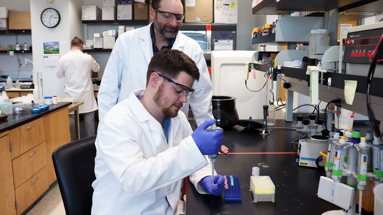 Biochemists in lab.
