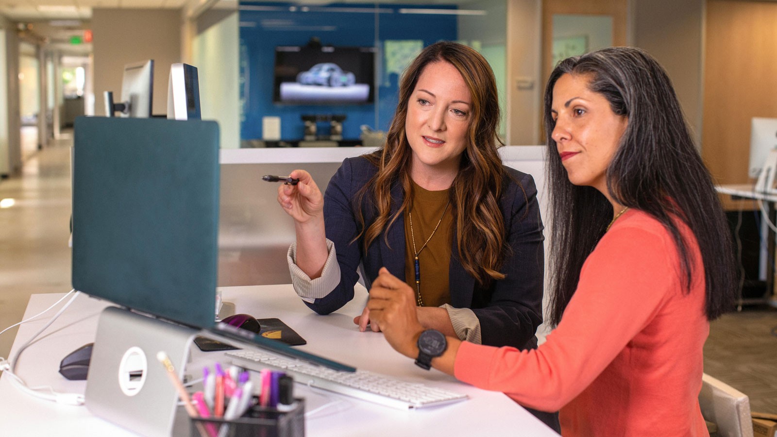 Women looking at a computer.