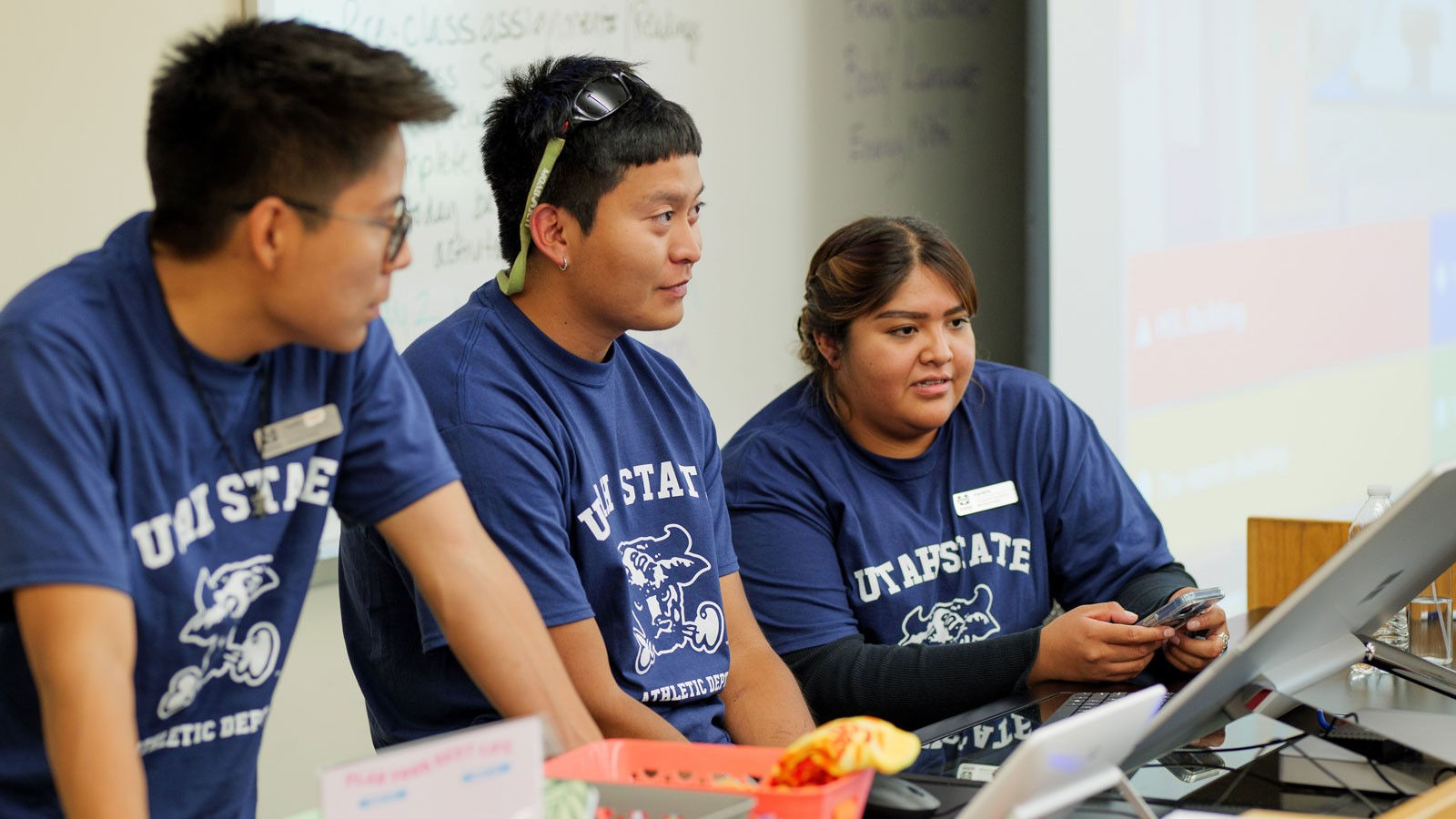 Students giving a presentation in a classroom.