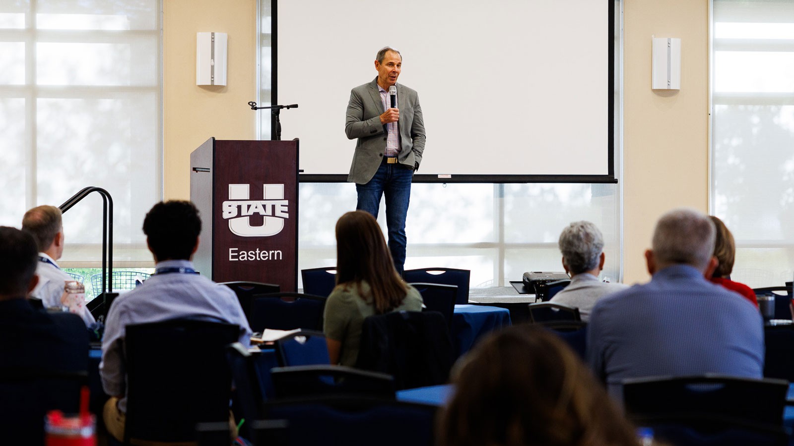 A person speaking at a conference.