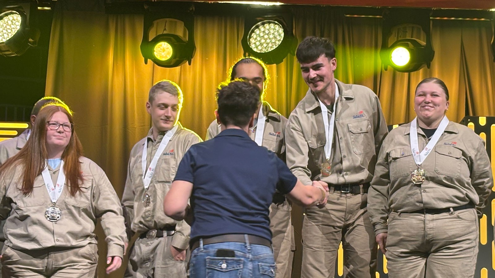 Welders at a SkillsUSA award ceremony.