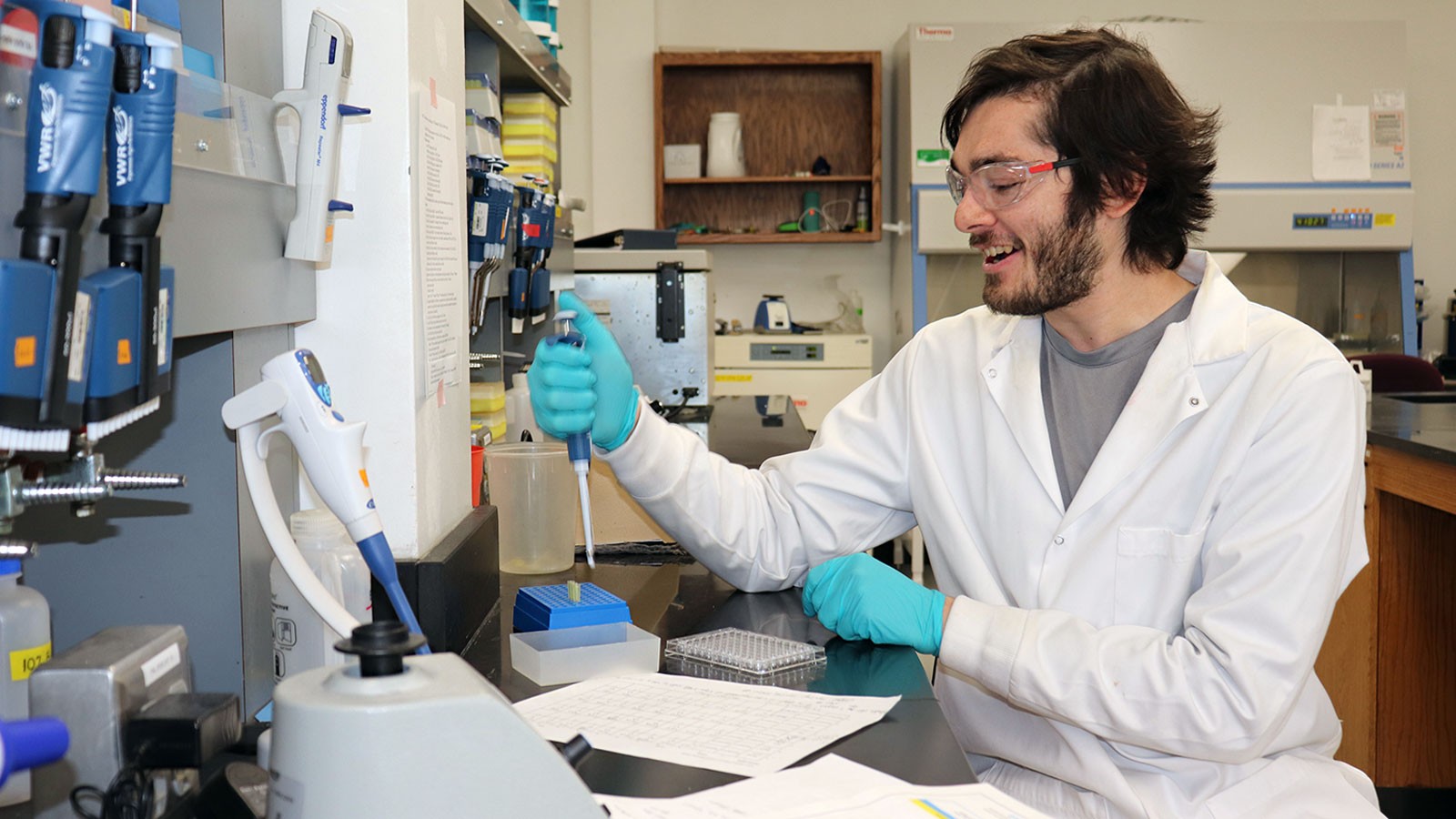 Daniel Emanuel at a lab bench.