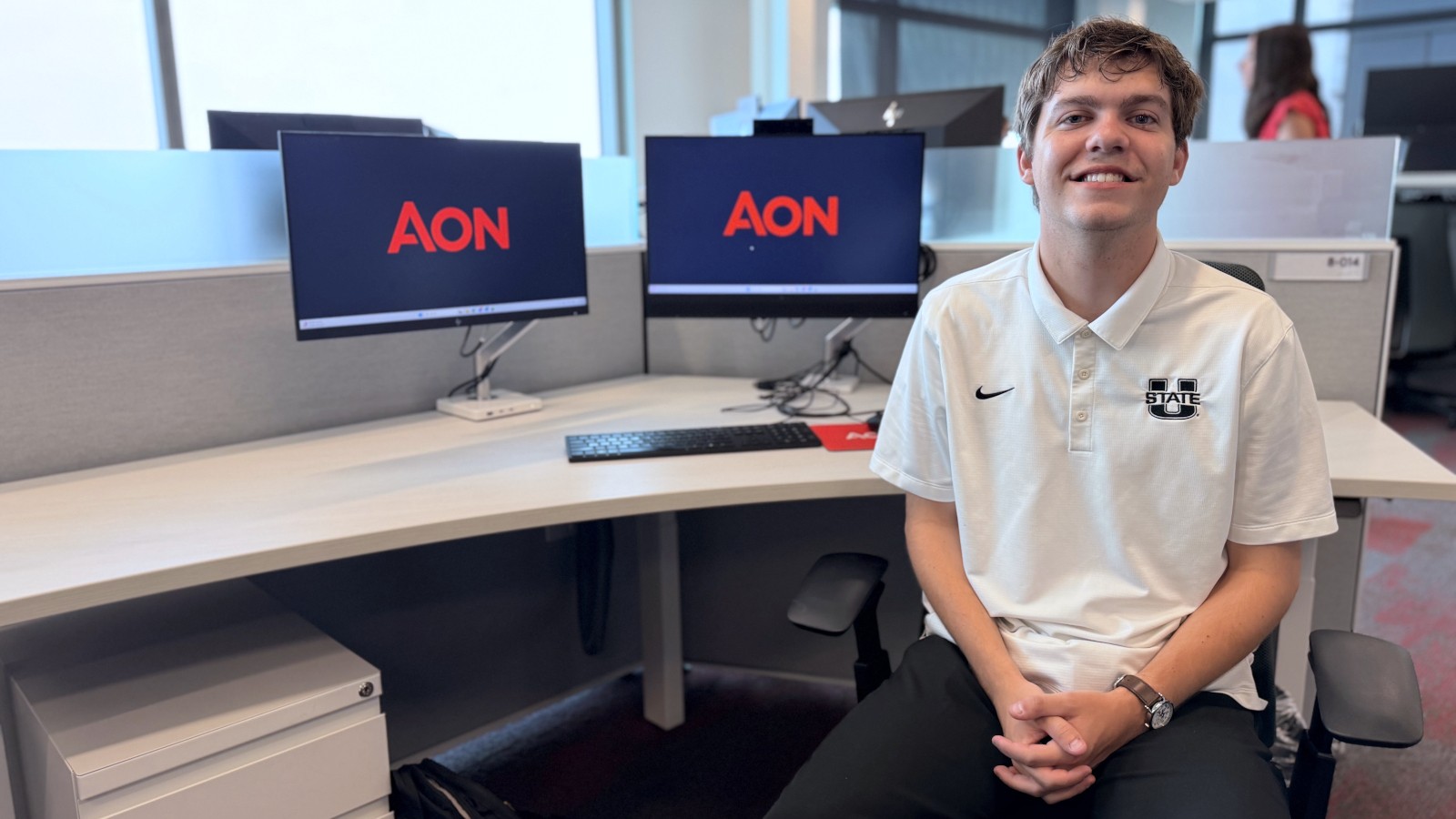 USU actuarial science student Briggs Rober at an office computer.