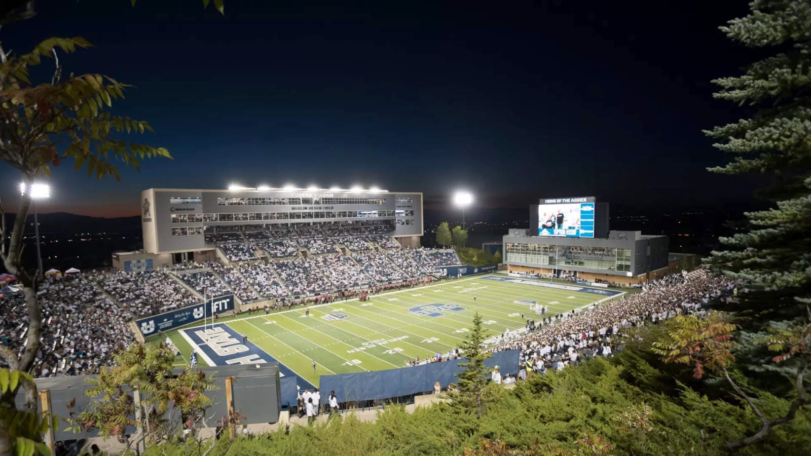 USU's Maverik Stadium during a football game at night.