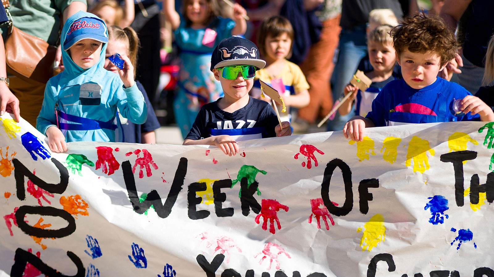 Children marching in a parade.