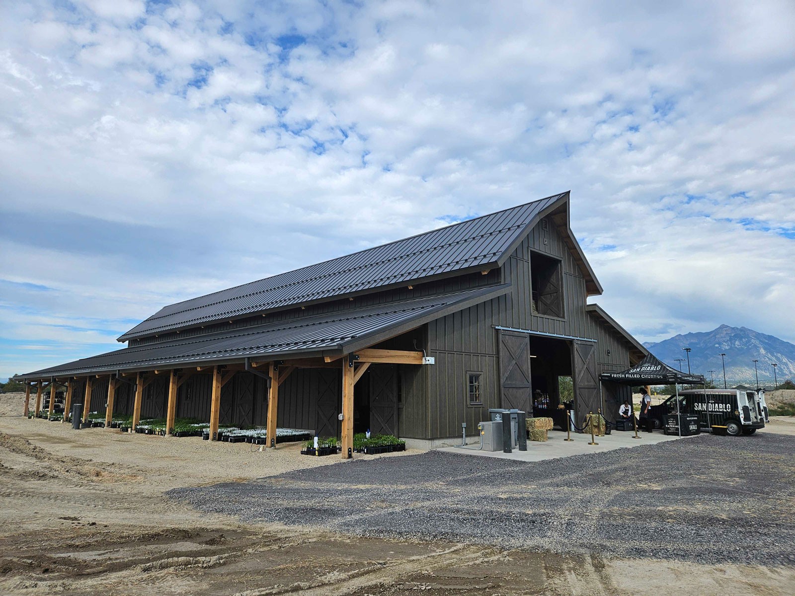 The exterior of a large barn.