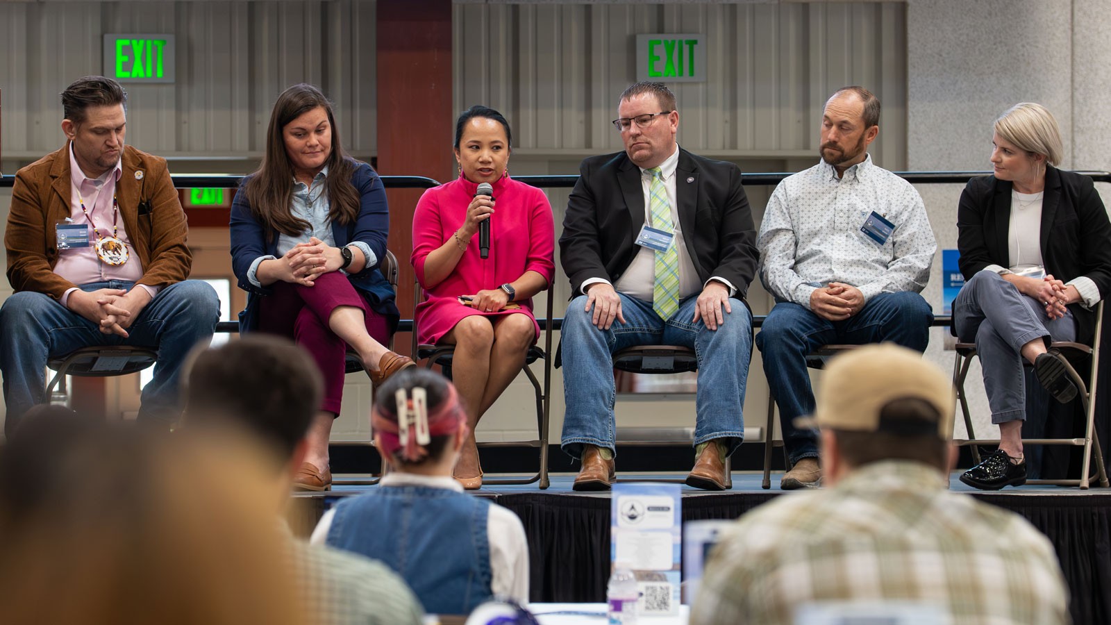 A panel speaking with an audience.