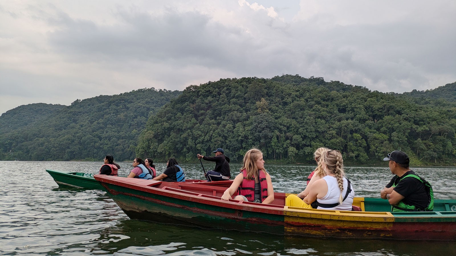People riding in boats.