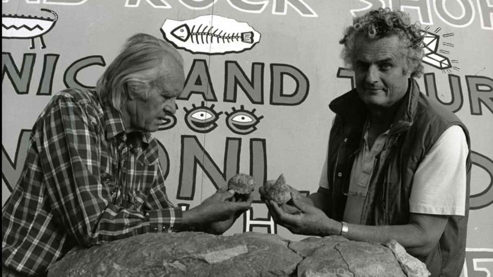 People examining fossils.
