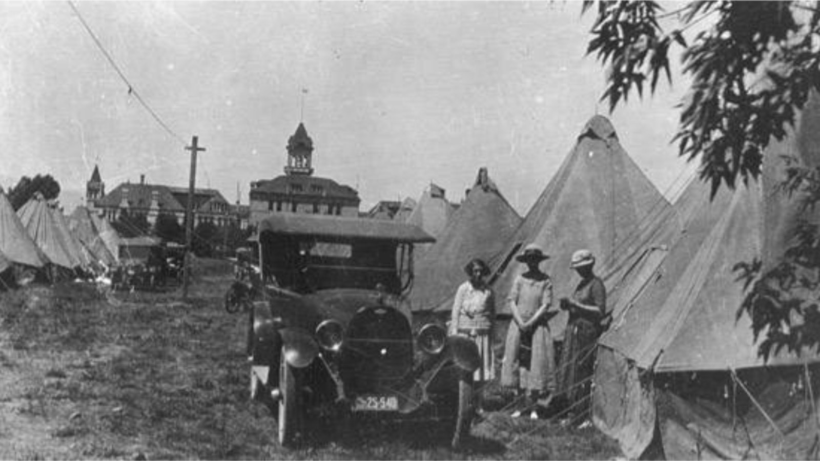 women gathered in historic image of the Farmer's Encampment.