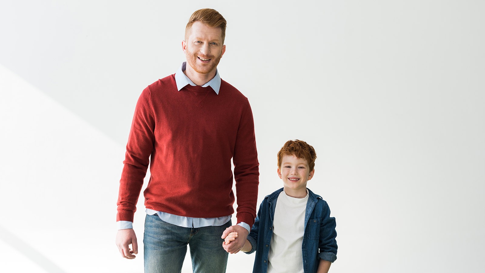 Father and son pose for a picture.