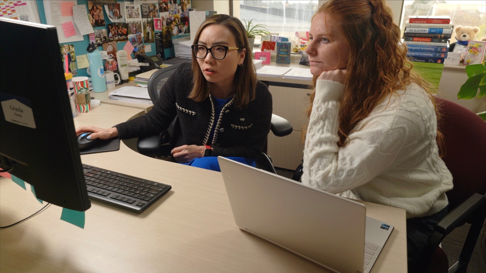 Image shows Grazia talking with her research assistant