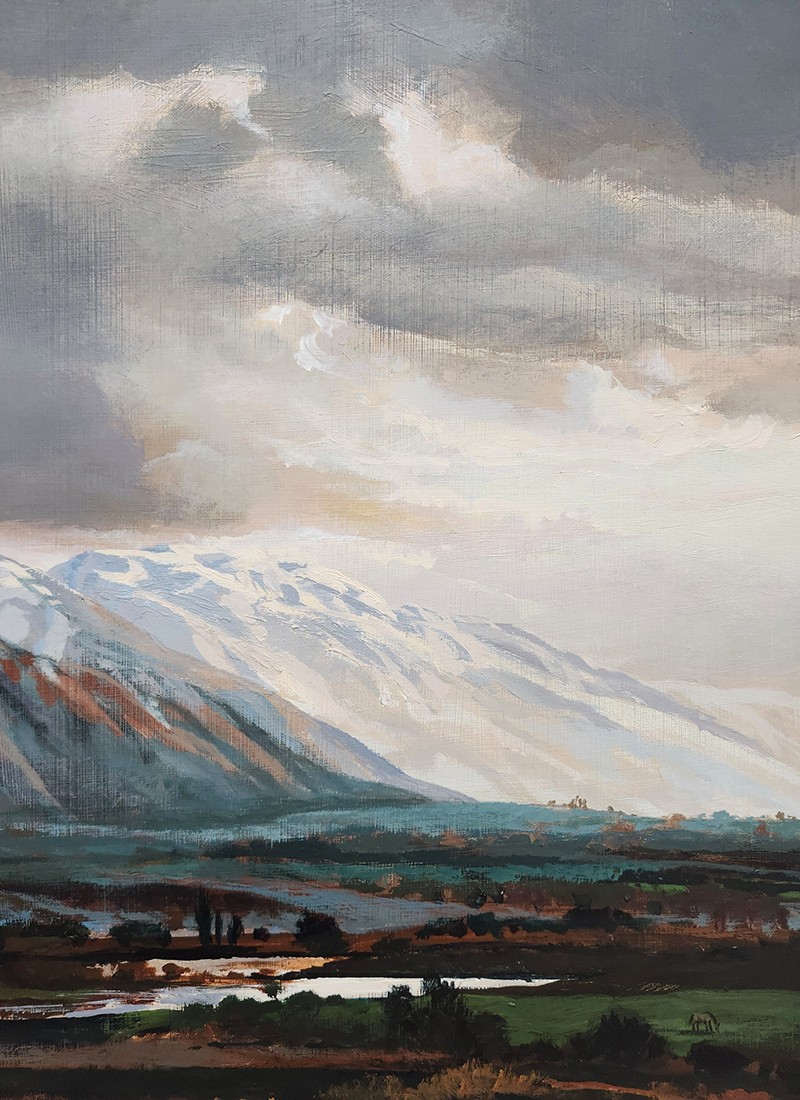 A painting of a snowcapped mountain range and valley.