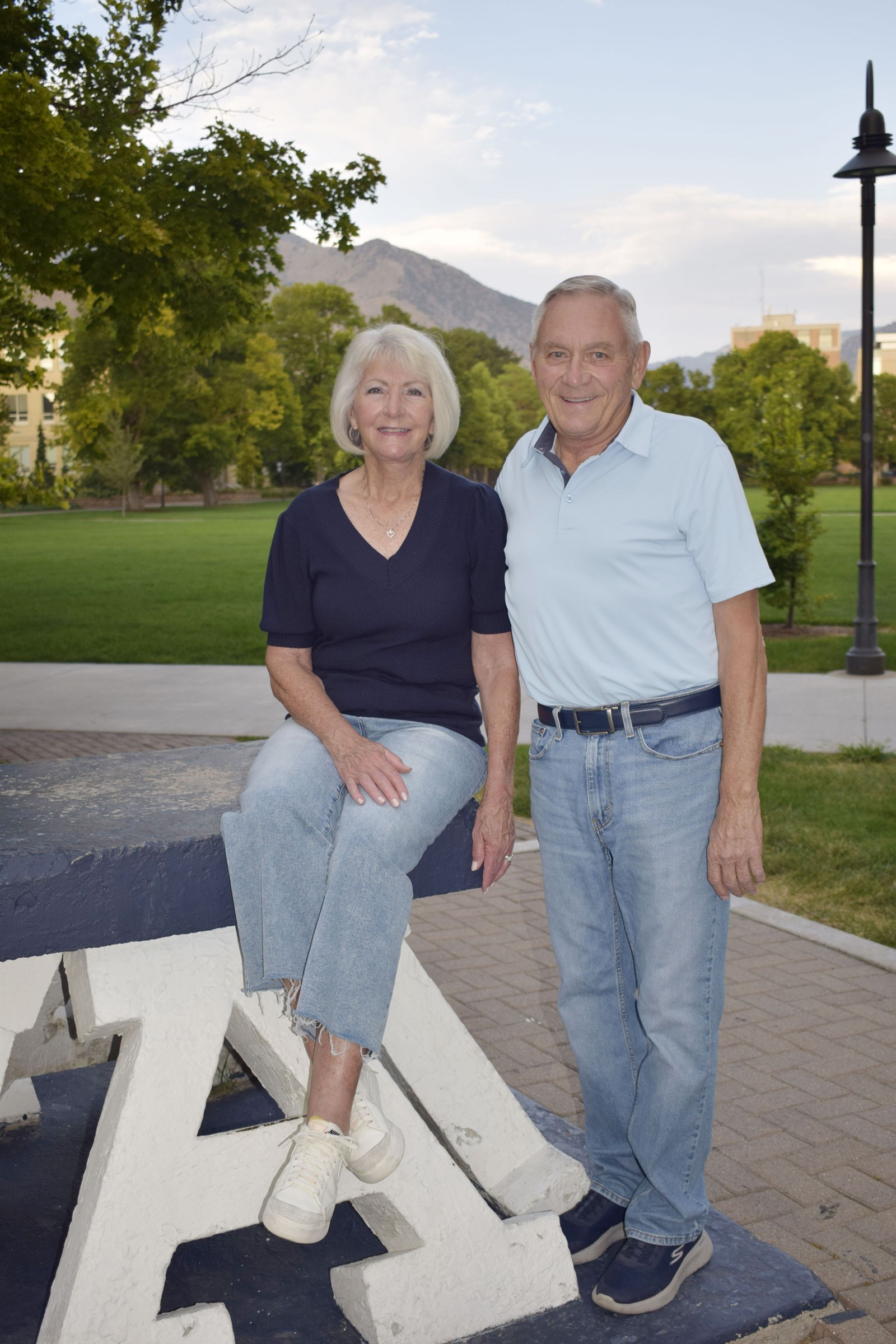 Craig and Lorraine Earl posing for a photo at the Block A on USU's Logan campus.