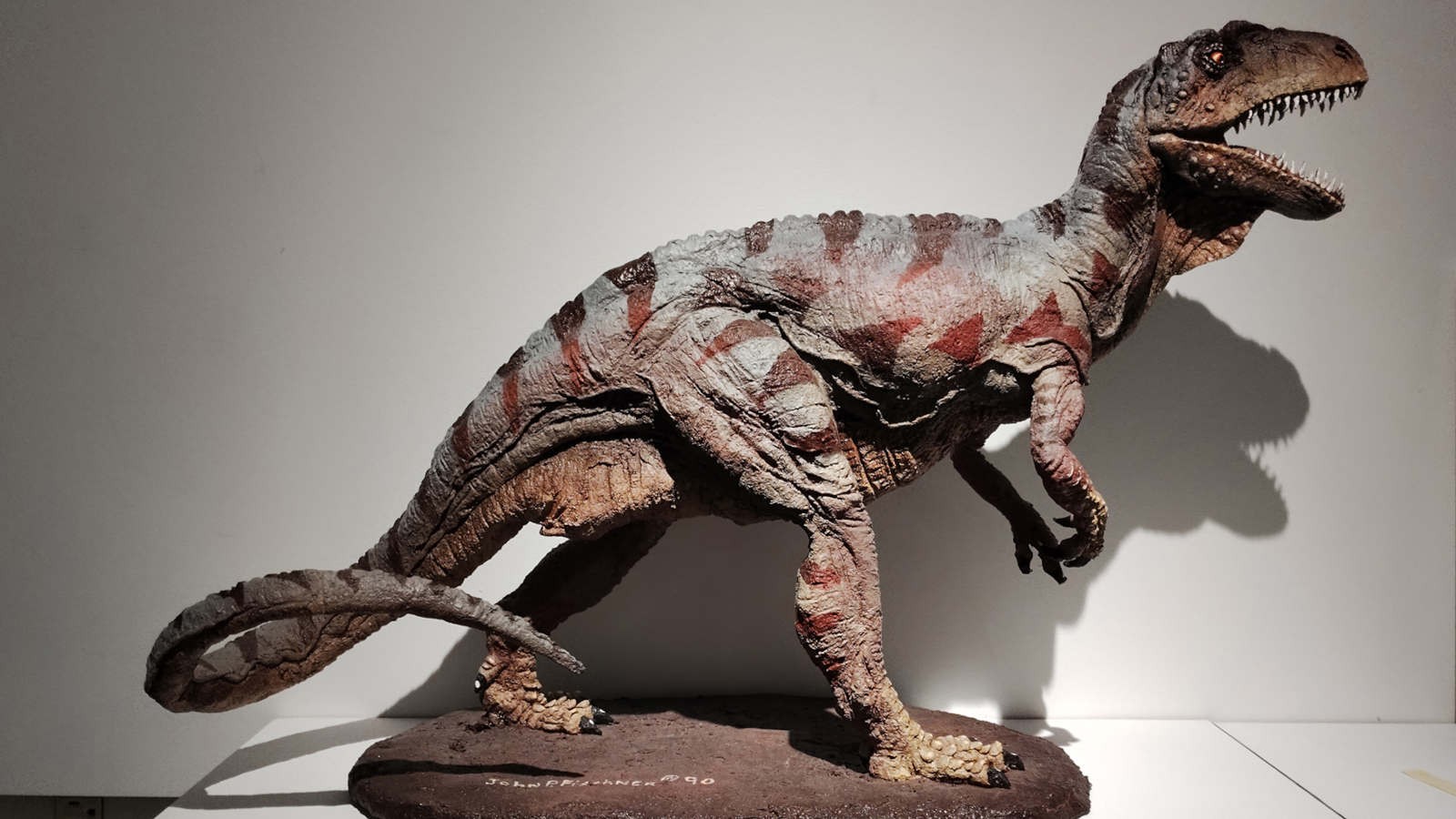 A sculpture of a dinosaur.