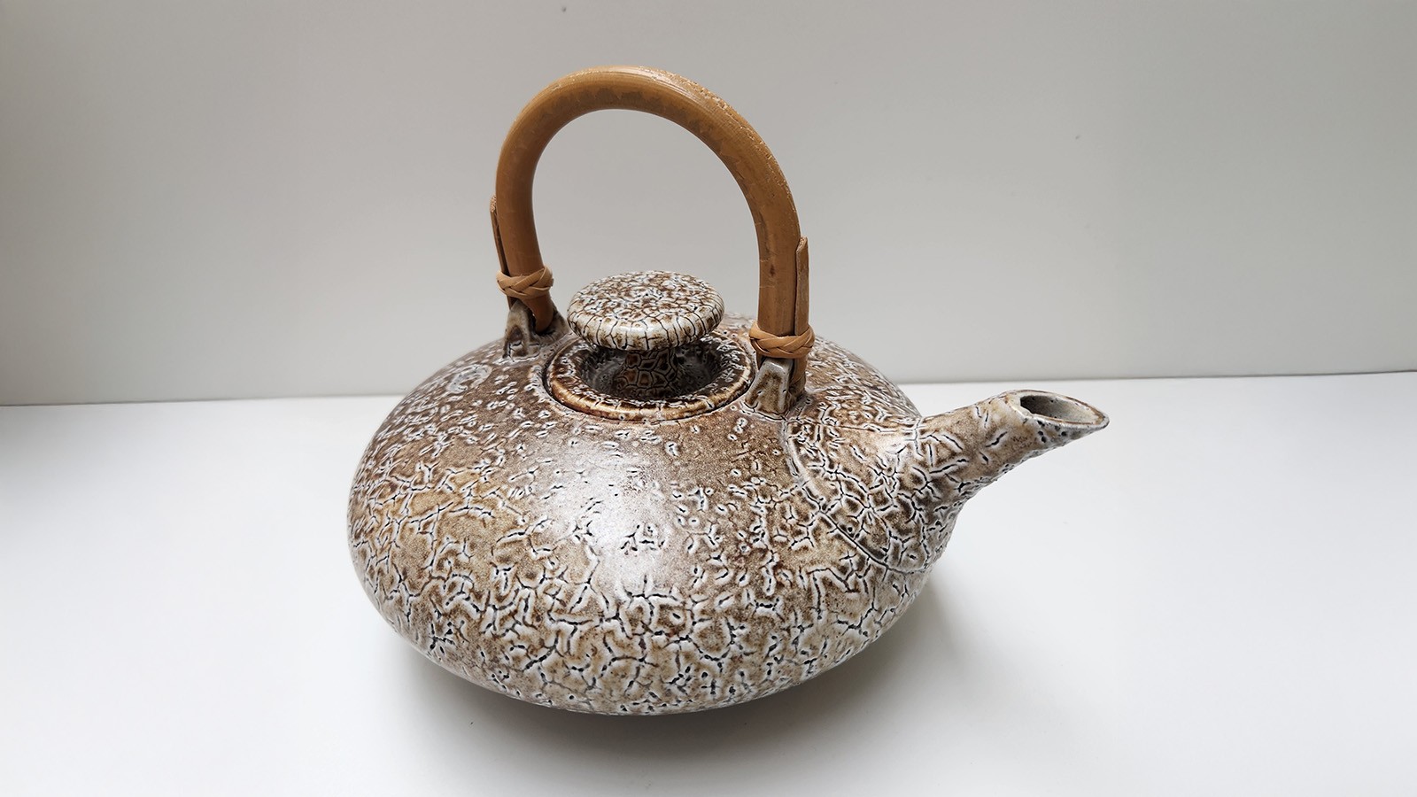 A ceramic pot on display at a museum.