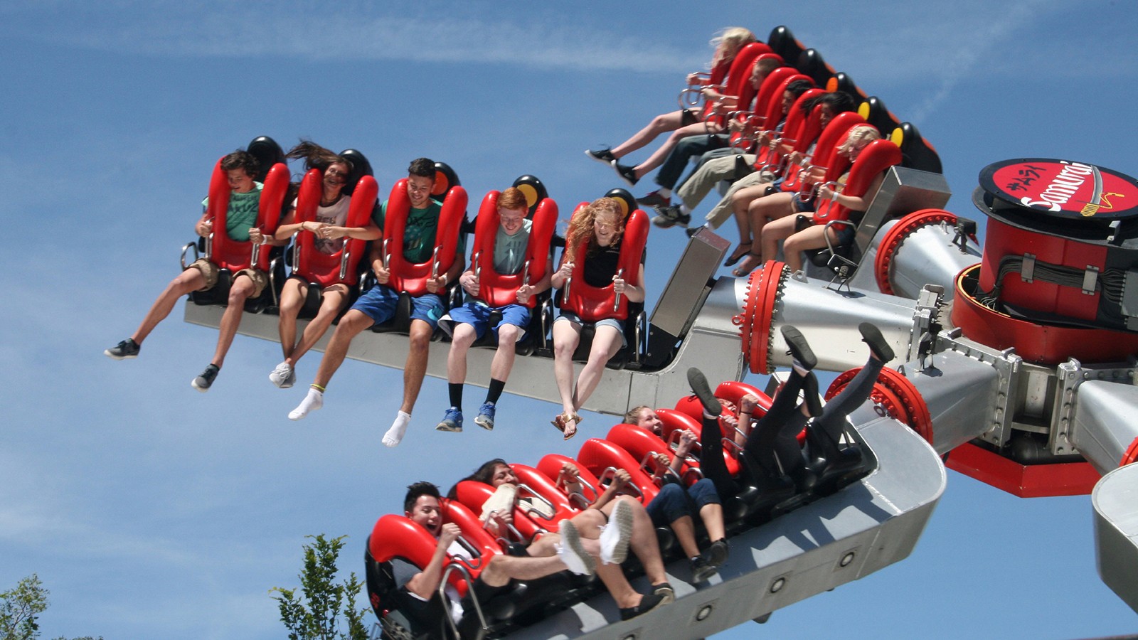 Teens on amusement park ride.