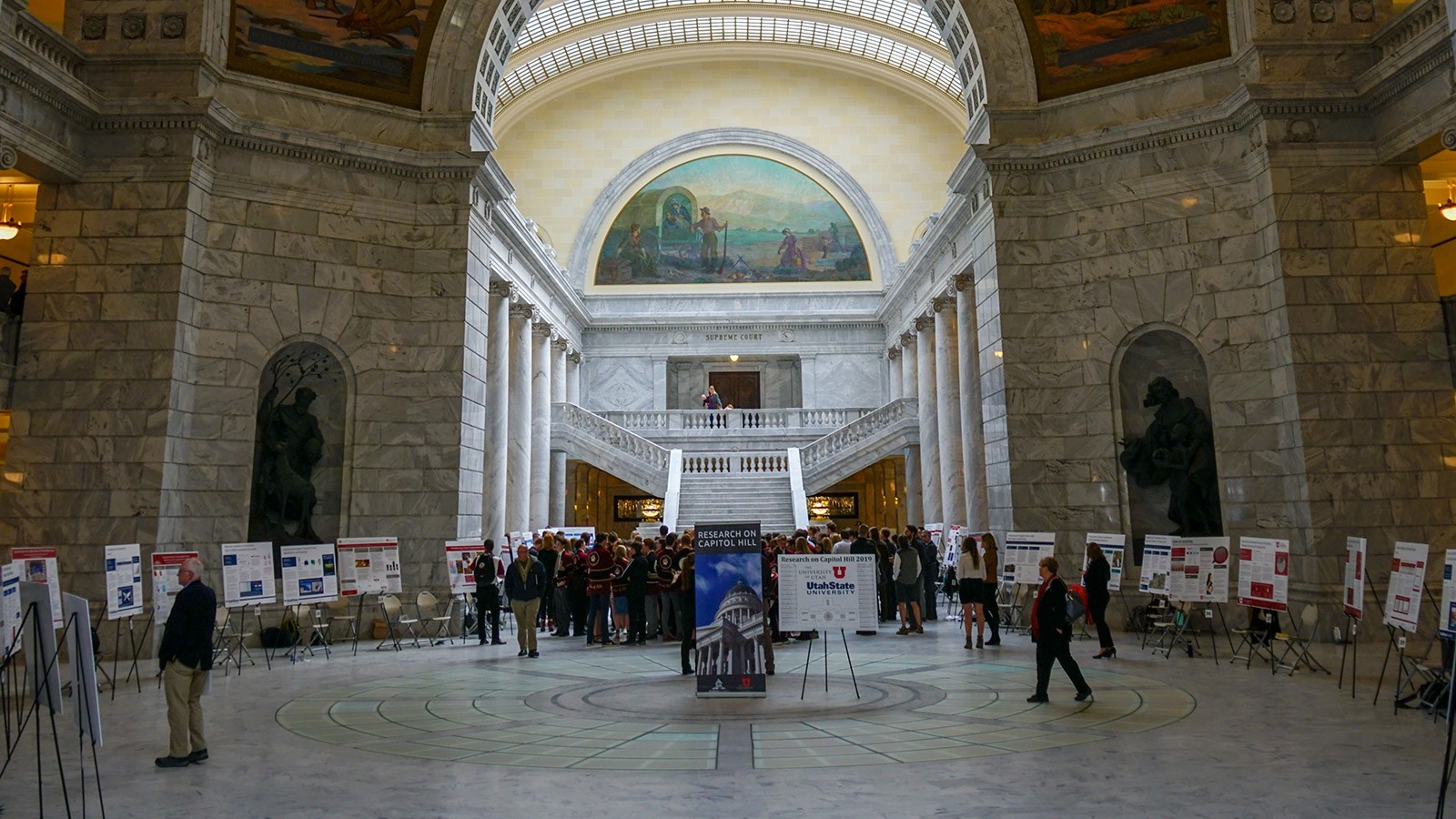 Undergrad researchers showcasing research at the Utah Capitol Rotunda.