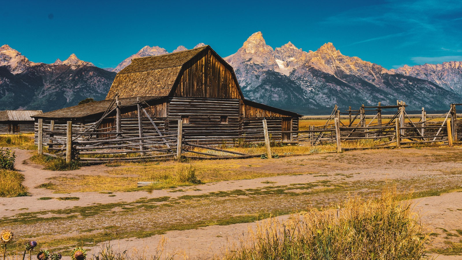 A barn in a mountain valley.