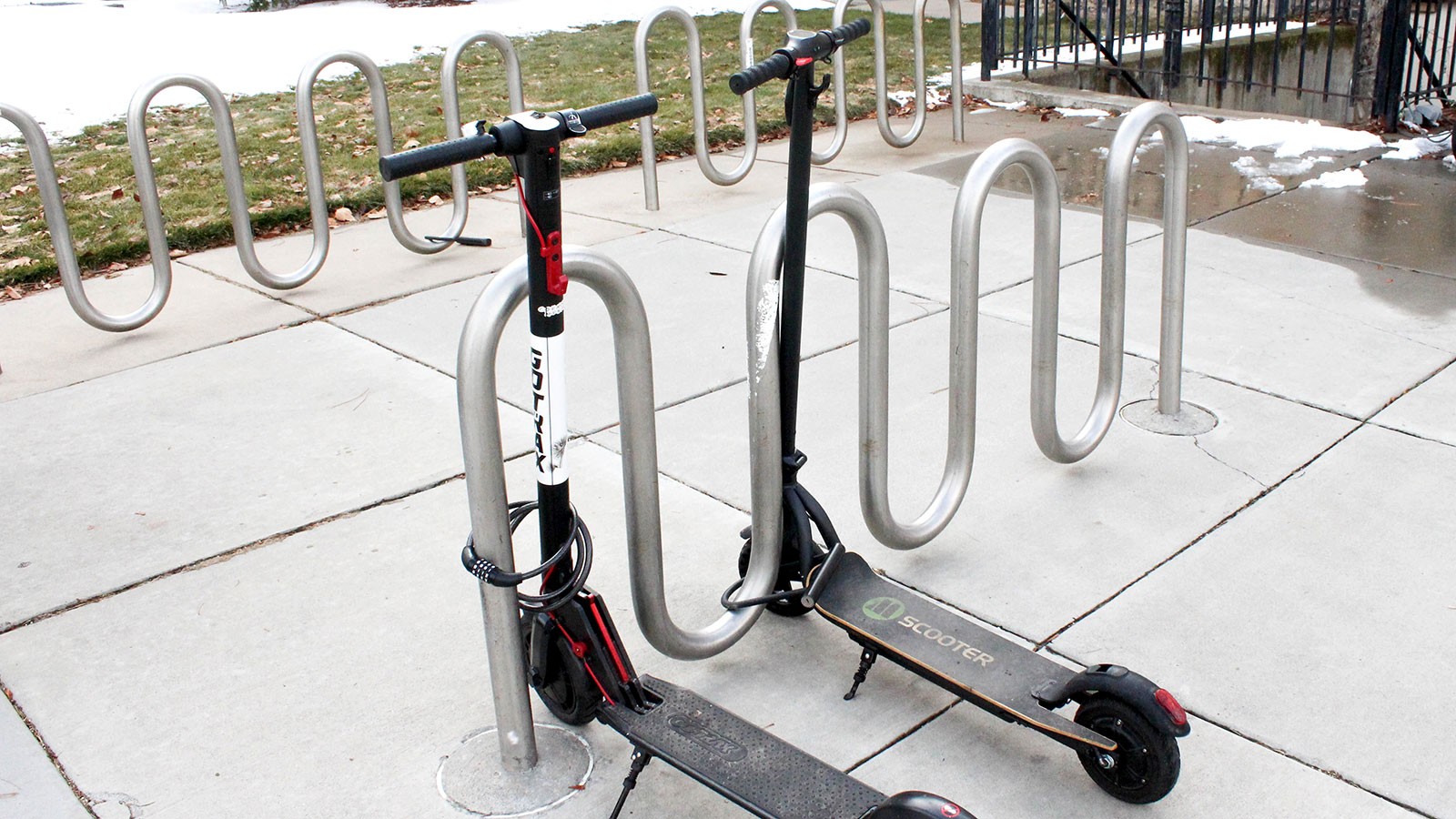 Electric scooters are pictured parked on campus.
