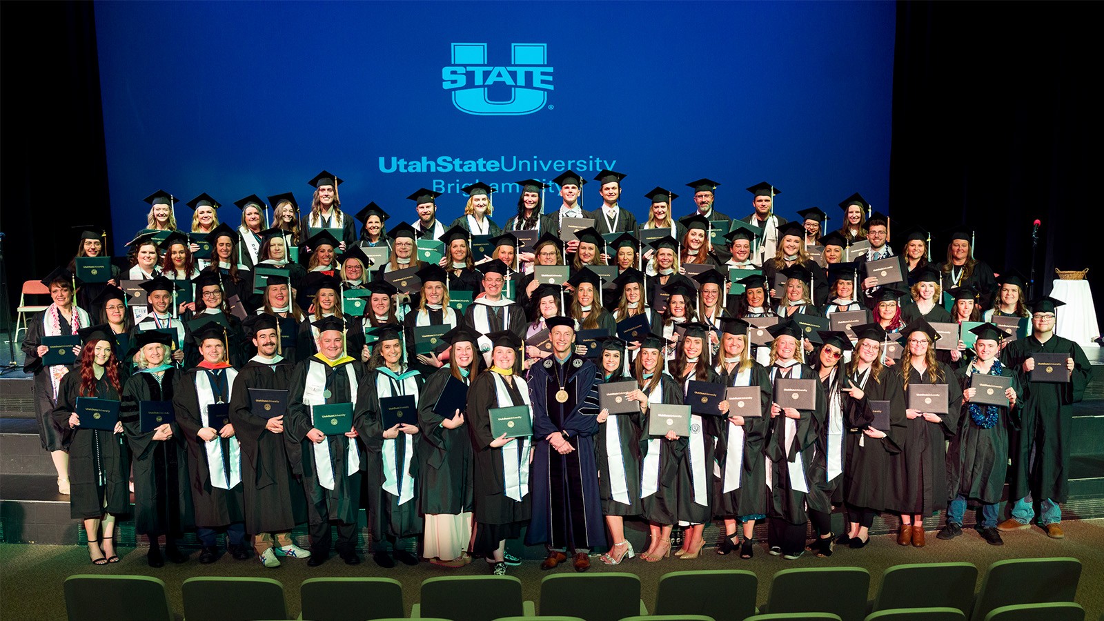 Students post after graduating
