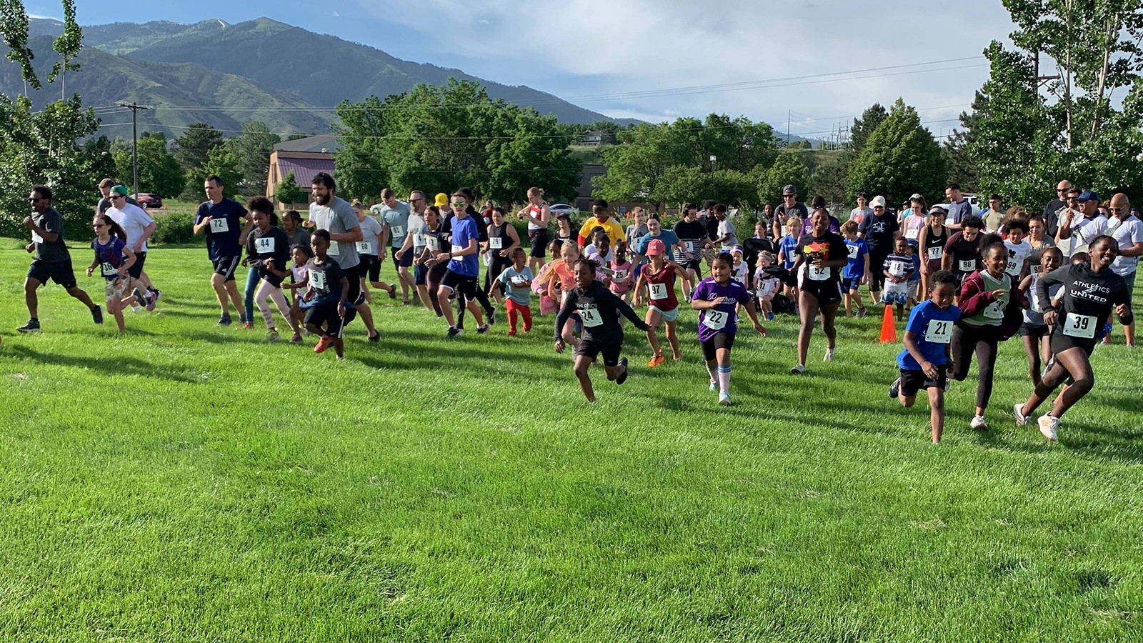A group of people run in a 5K race