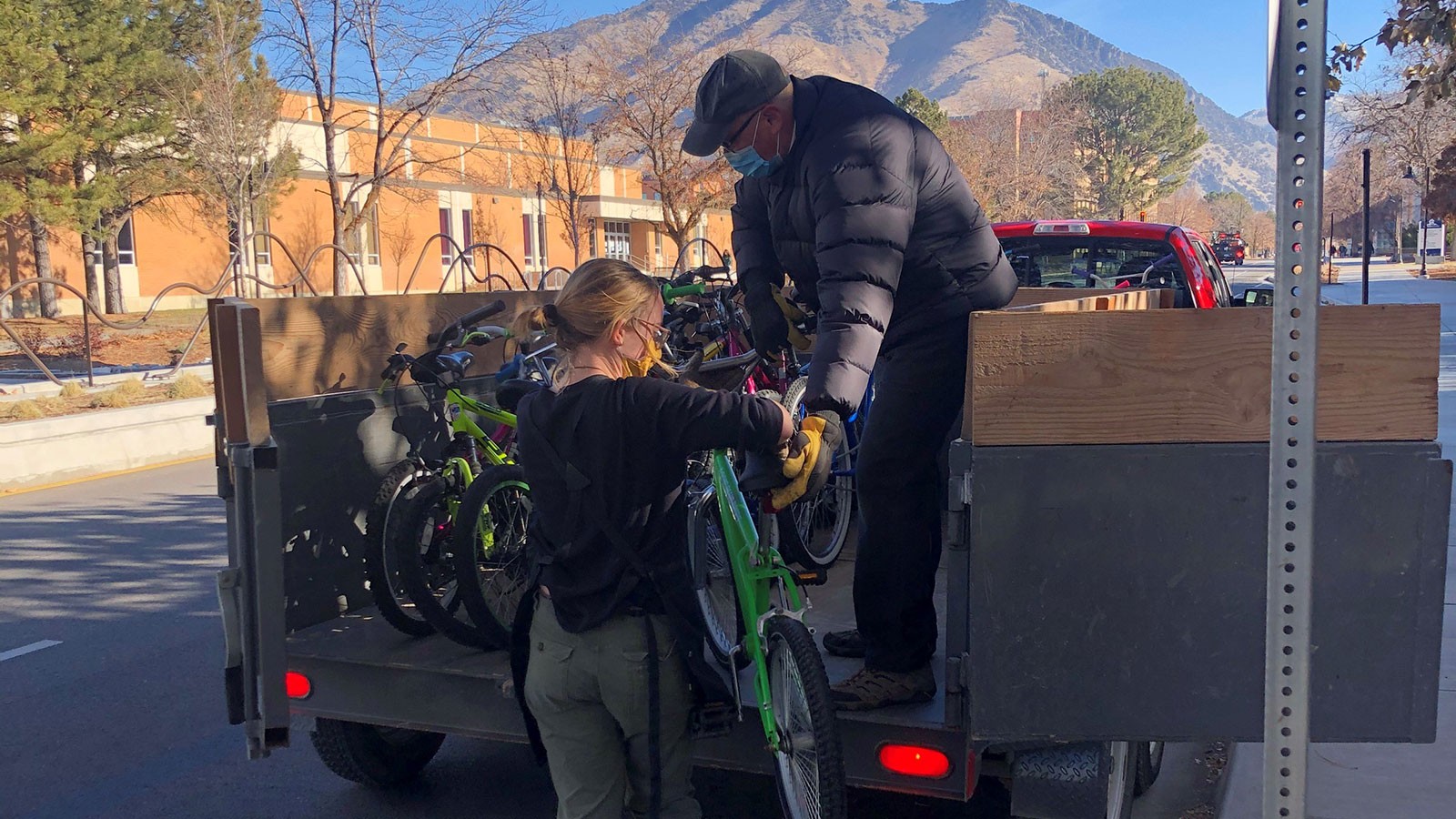 Aggie Blue Bikes employees gather bikes to donate to Sub for Santa.
