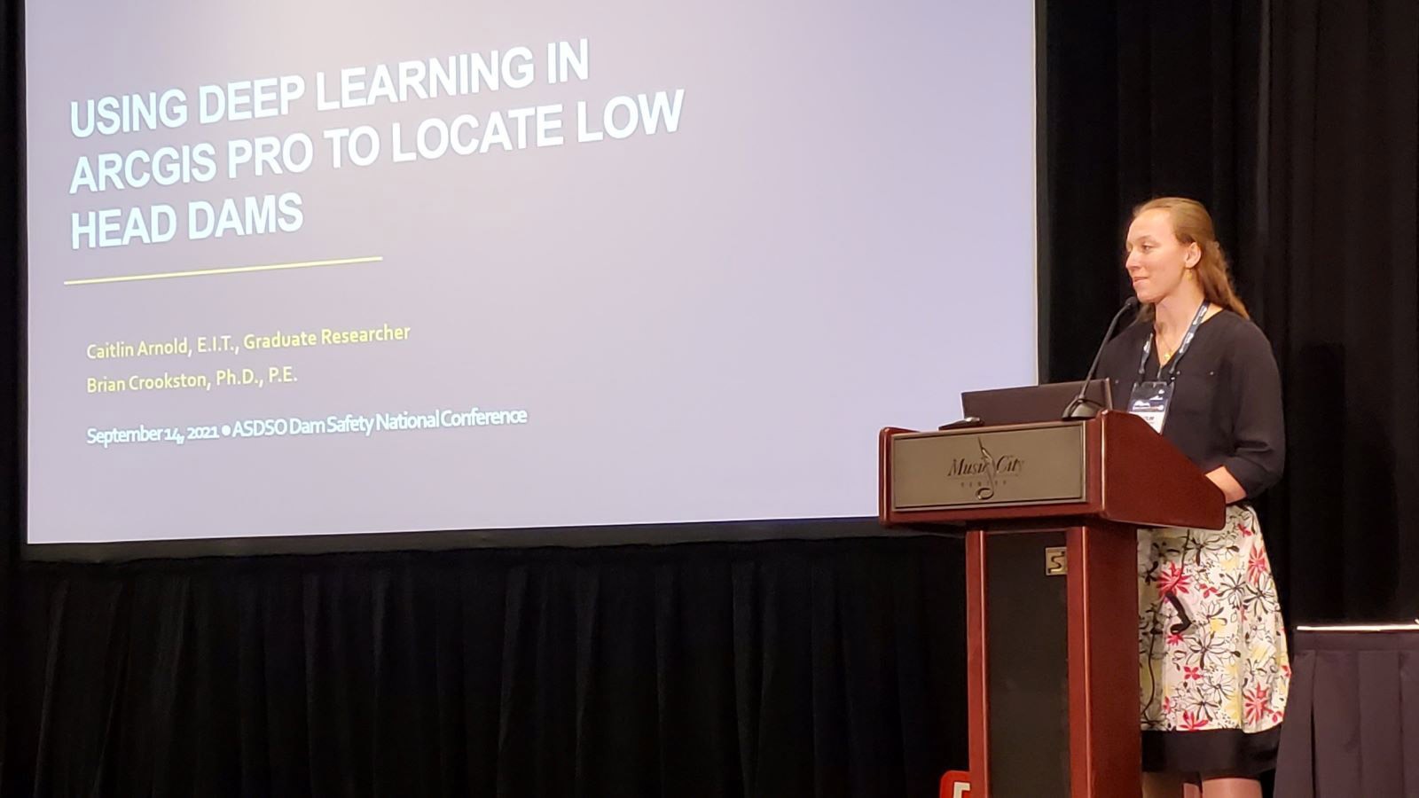 Caitlin Arnold presents her research at the Association of State Dam Safety Officials in Nashville.