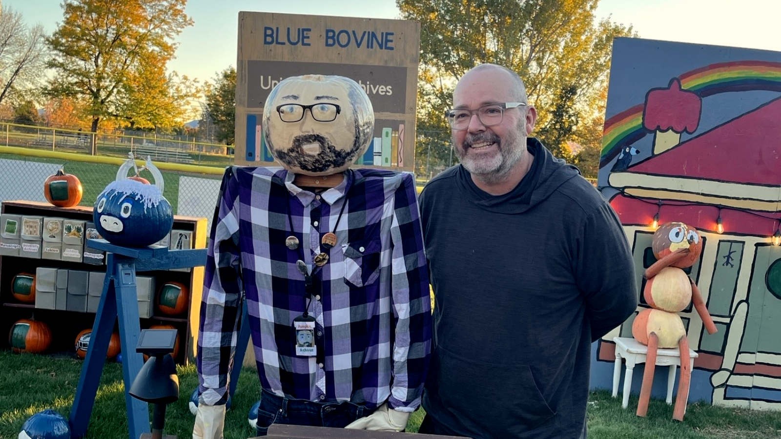 Dan Davis and a mannequin with a pumpkin head painted to look like Dan Davis.