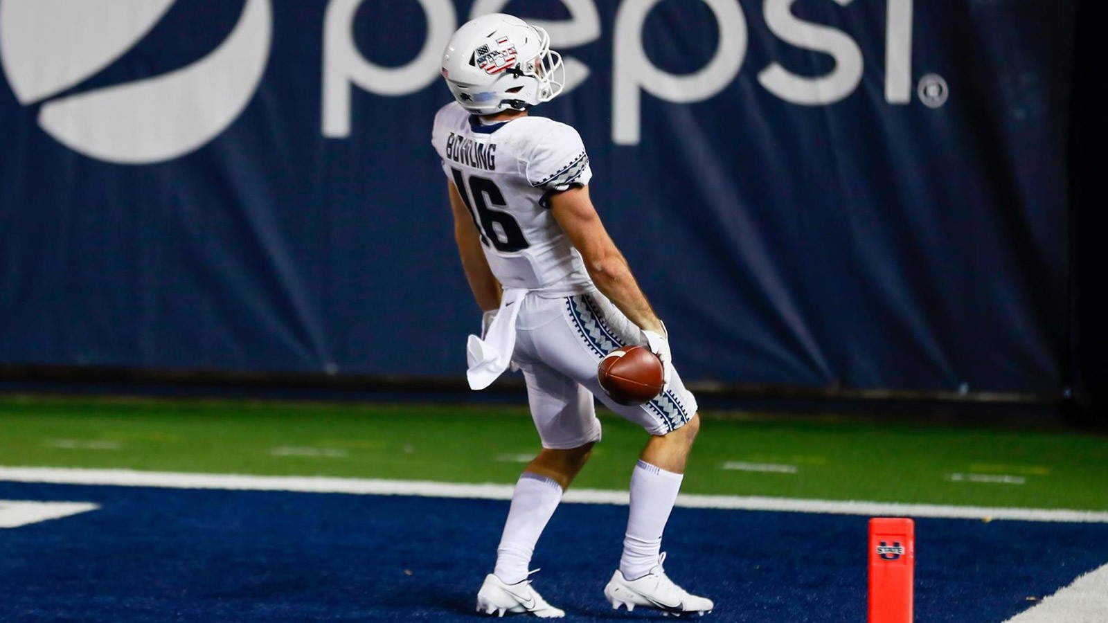 USU football player celebrates on the field.