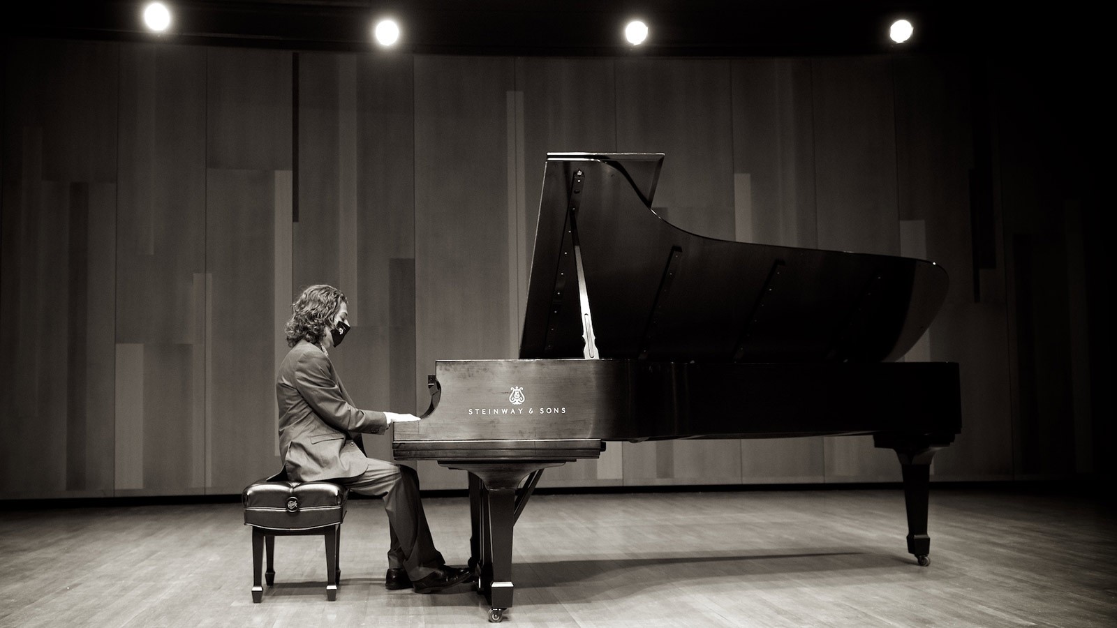 Piano player in the Russell/Wanlass Performance Hall.