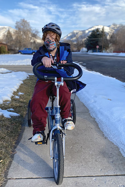 Garrett on the therapeutic trike that helped him win a science fair
