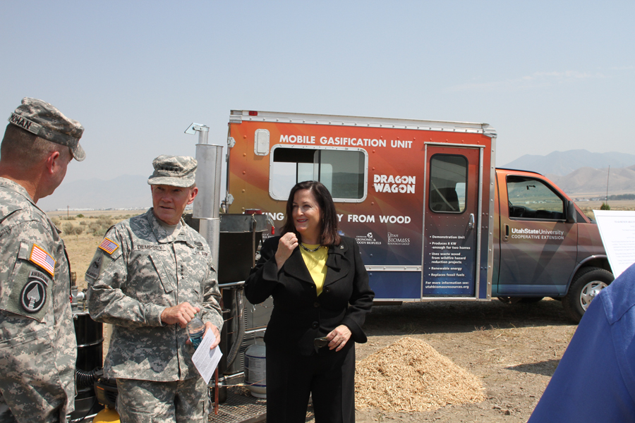 General Dempsey and Assistant Secretary Hammack stand in front of the Dragon Wagon.