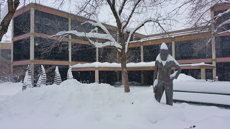 Utah State University building in the snow. 