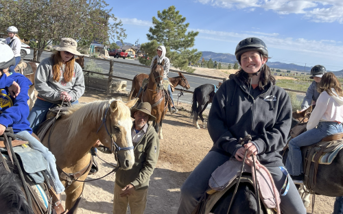 students riding horses