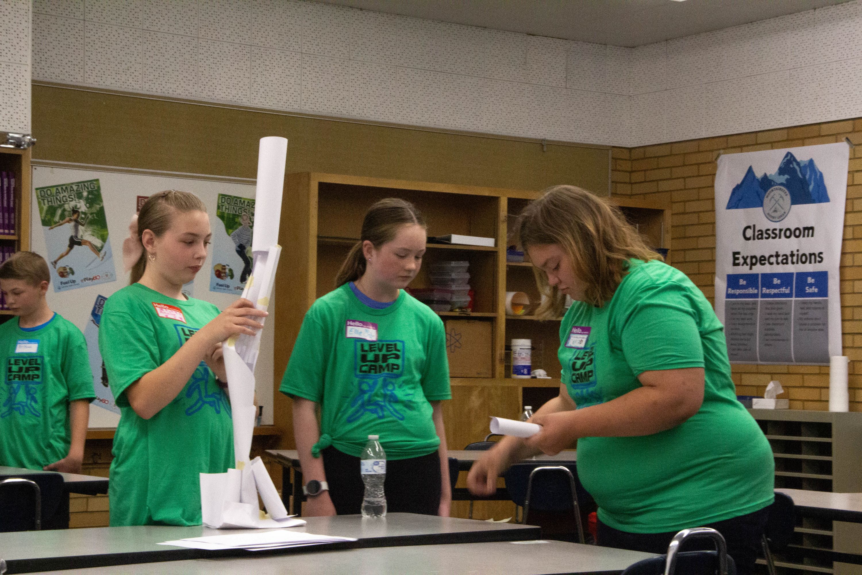 students in a classroom working together on a project
