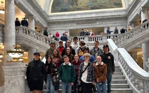 Group photo of students on a college campus.