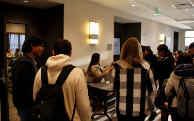 students checking into their rooms and picking up nametags