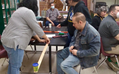 Teachers perform an experiment.