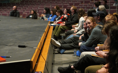 Students sitting in an auditorium.