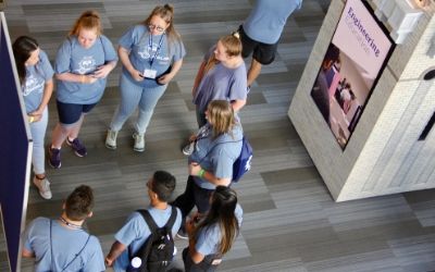 Students giving a presentation at a summer camp.