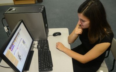 Student working at a computer.