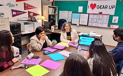 Paula working with students