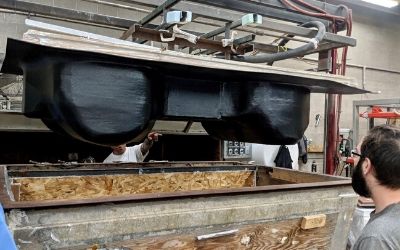 The first car body is shown inverted coming out of Magic Vac’s ovens.