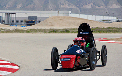 A GEAR UP student driving their team's electric car.